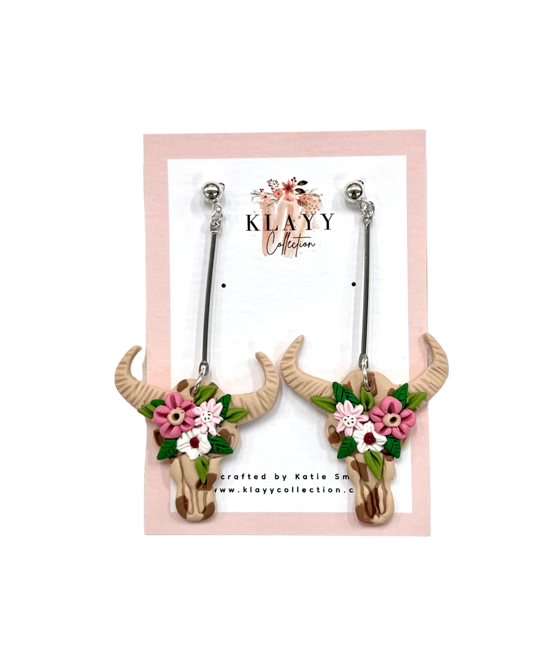 Desert Bloom handcrafted polymer clay earrings by Klayy Collection – boho bull skulls with pink florals. Bold, lightweight, & full of Western flair.