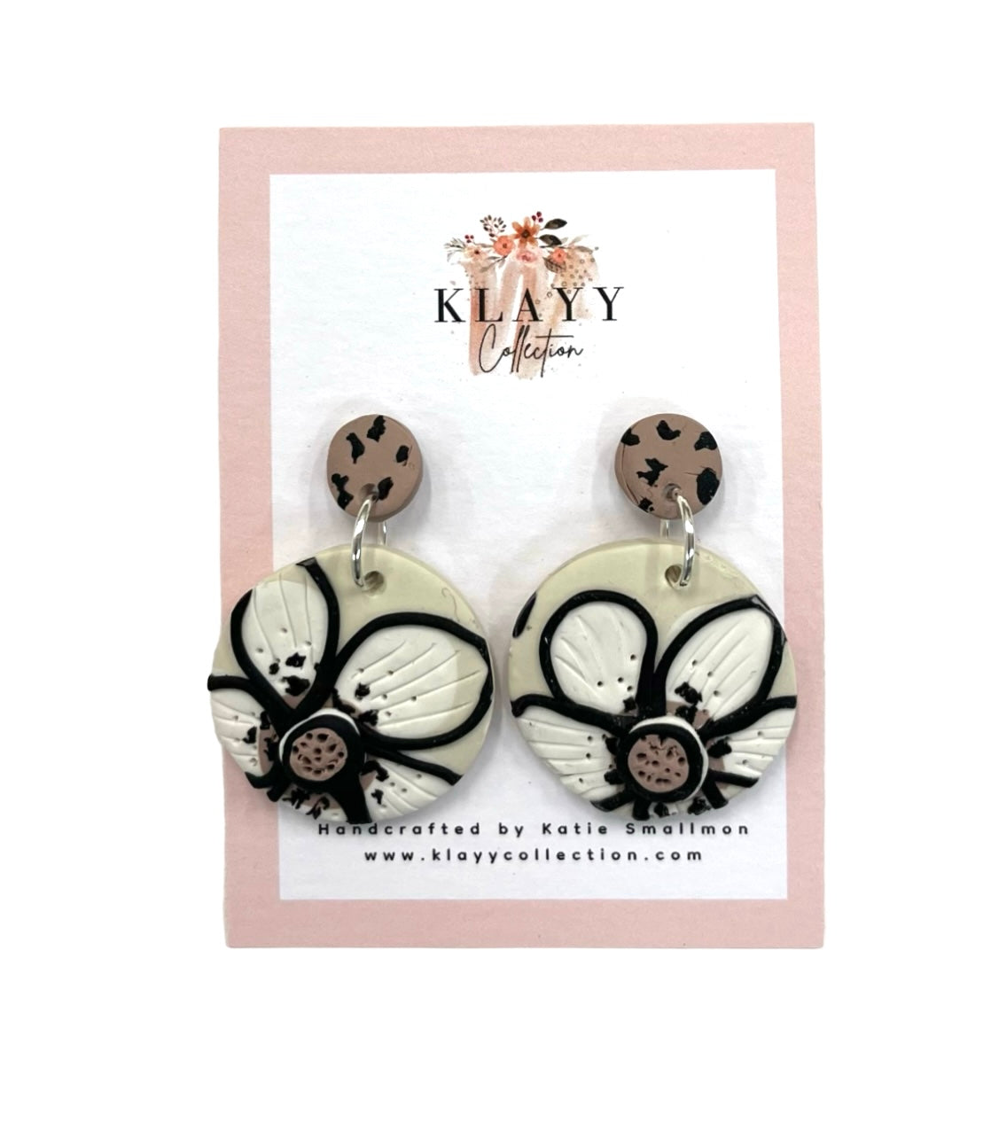 Retro-inspired black & white floral polymer clay earrings. Handmade statement drops that blend bold fun with timeless style.