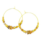 Amber Glow Hoops by Art in Stone — handmade gold and amber beaded hoop earrings with crystal detail for elegant, glowing everyday style.