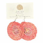 Sunset Glow handwoven earrings by Gomeroi artist Debbie Wood. Large, circular raffia earrings in warm sunset hues for a natural, elegant style.