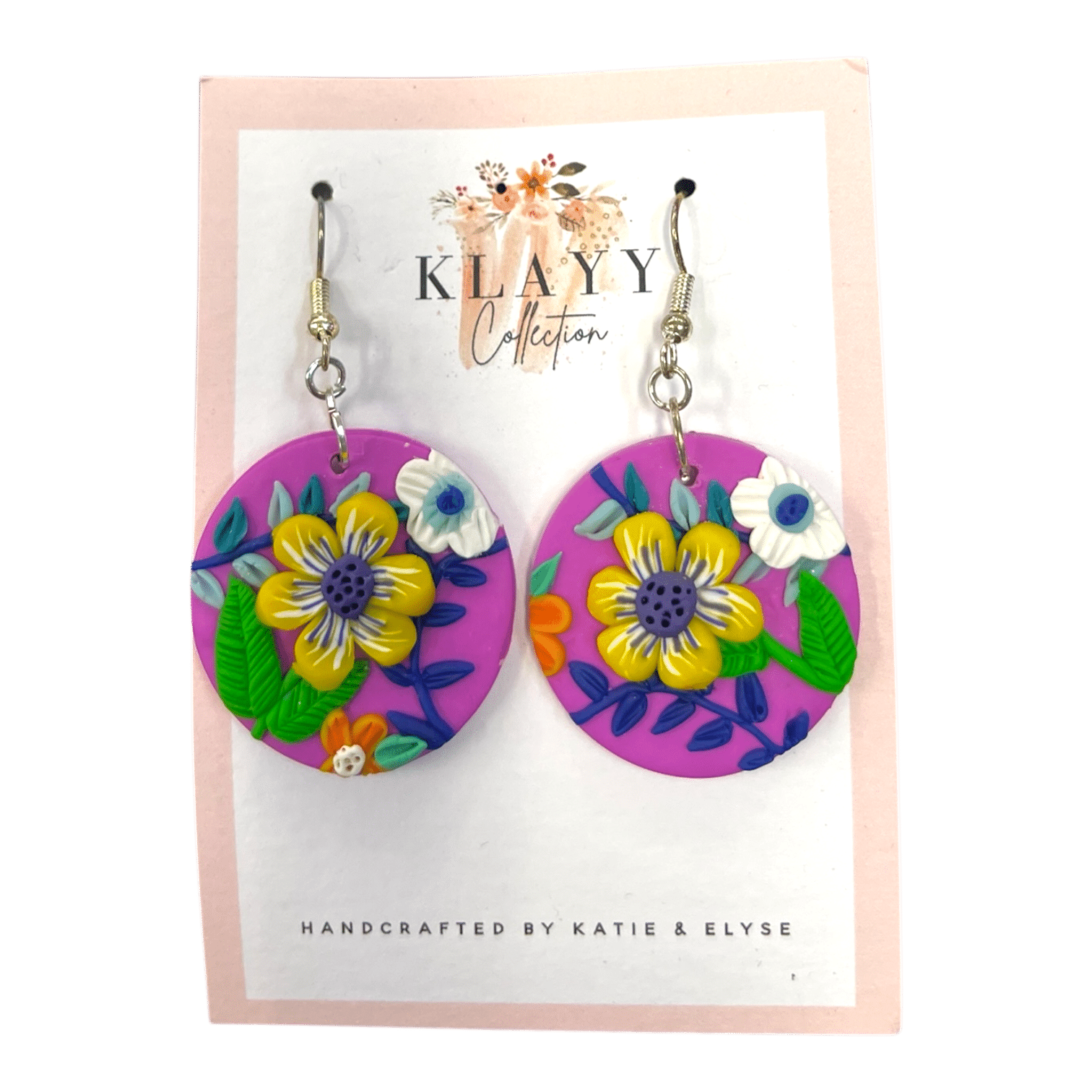 Sunshine Bloom earrings pop with cheerful yellow flowers on bright pink clay. Handmade fun for everyday wear.