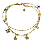 The Honey & Gold Necklace by Art In Stone Jewellery features golden honeycomb, bee charms, and citrine gemstones, a nature-inspired statement piece.