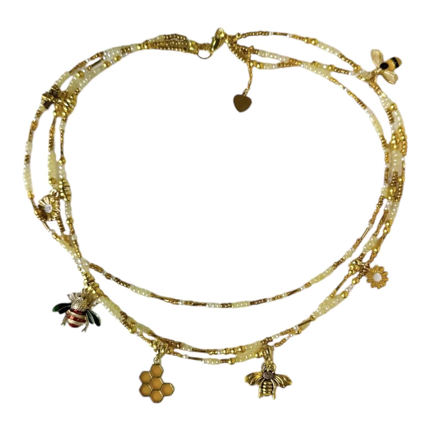 The Honey & Gold Necklace by Art In Stone Jewellery features golden honeycomb, bee charms, and citrine gemstones, a nature-inspired statement piece.