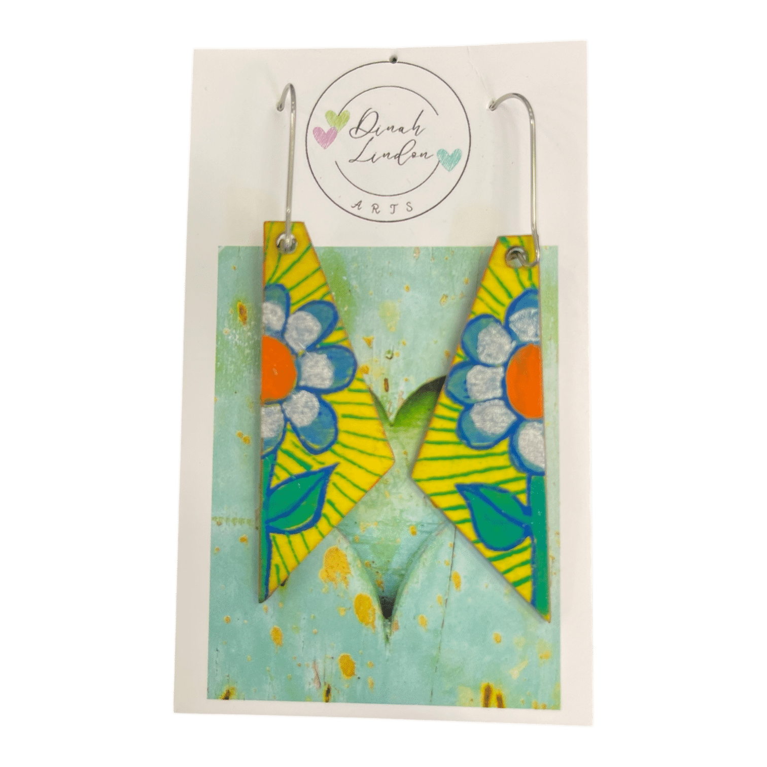 Daisy Stripe Arrows – angular yellow earrings handpainted with bold daisies and vibrant green leaves by Dinah Lindon.