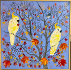 Cockatoos in autumn leaves