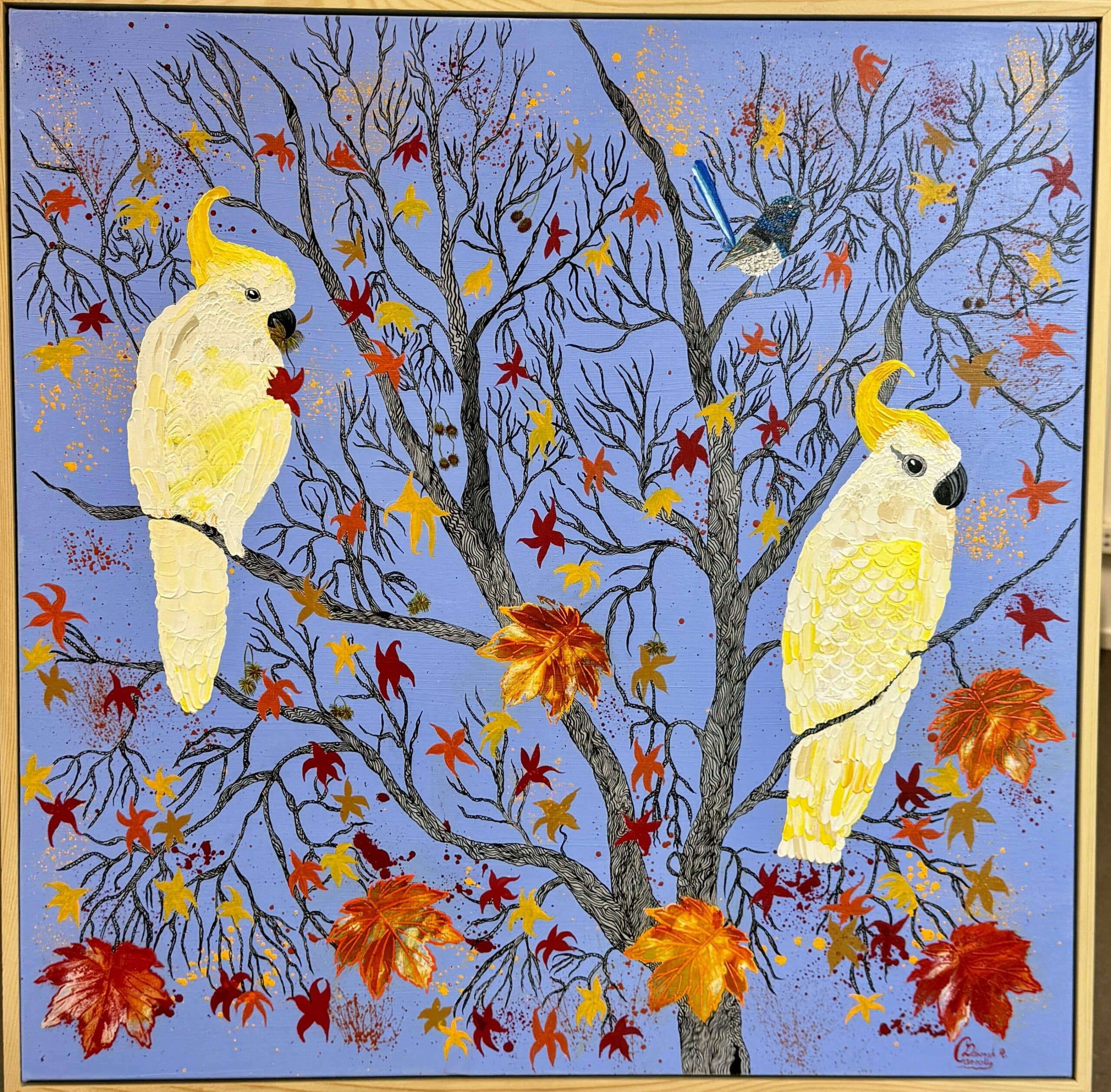 Cockatoos in autumn leaves