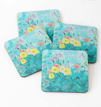 Add elegance to your decor with Maggie Deall’s floral coaster set, featuring soft blooms on a blue background. Perfect for art lovers and nature enthusiasts.