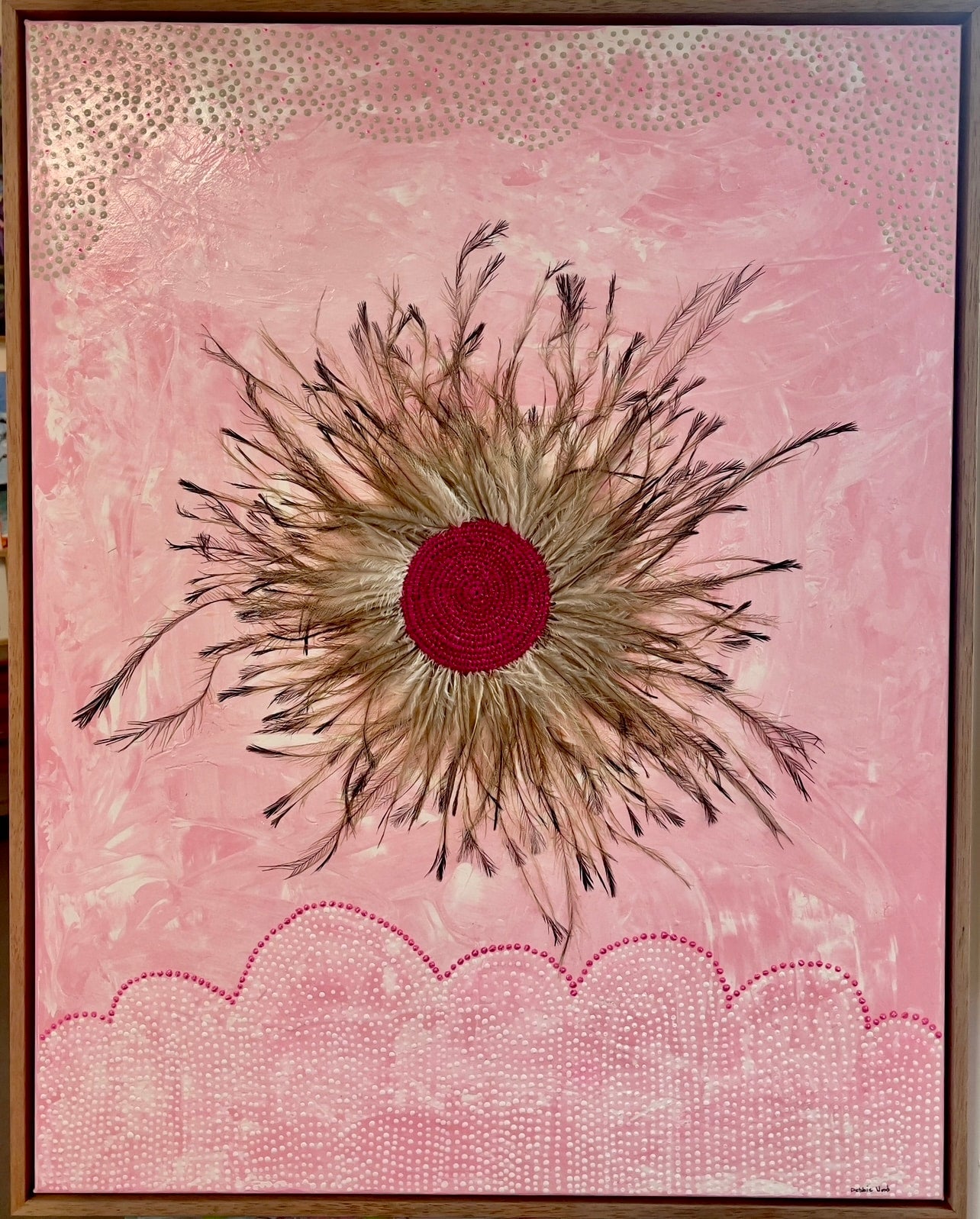 Discover new mixed media works by Gomeroi artist Debbie Wood—woven raffia, emu feathers, and paint unite in stunning cultural storytelling.