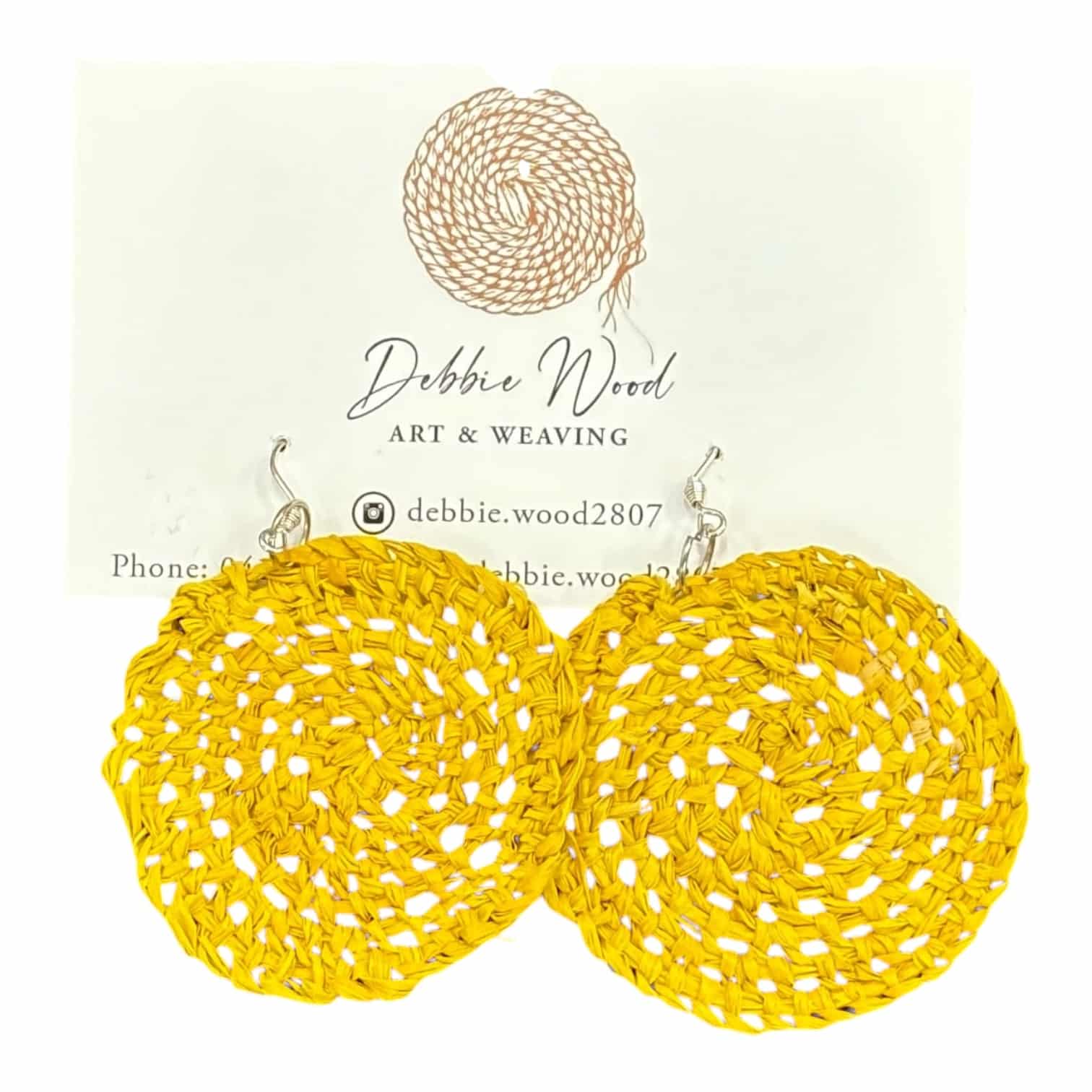 Golden Radiance handwoven earrings by Gomeroi artist Debbie Wood. Vibrant yellow raffia earrings that bring a cheerful, sunny touch.