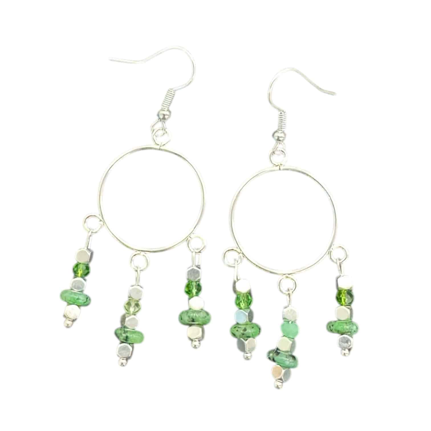 Gleaming green crystal earrings that shimmer with light — the Emerald City Drops by Art in Stone are effortlessly elegant and fun.