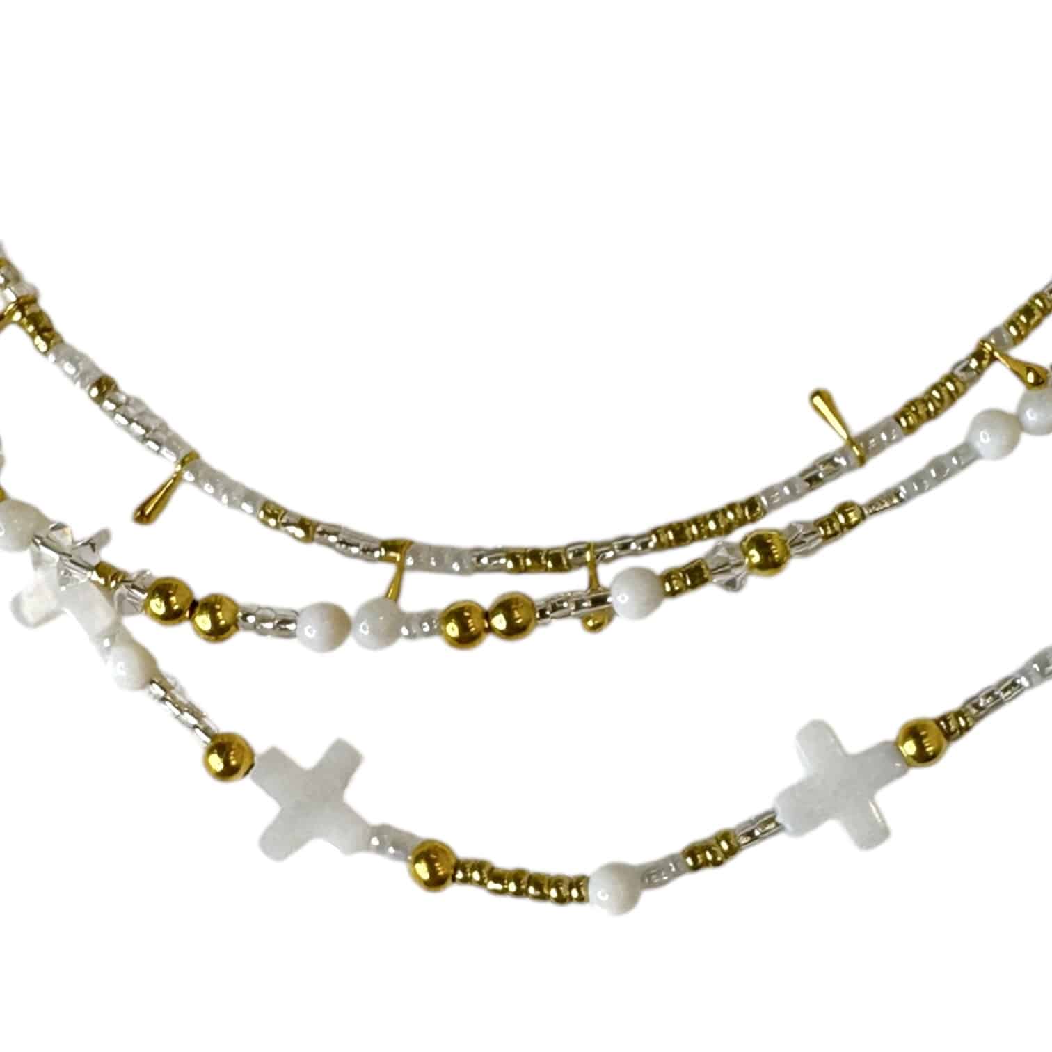 Handmade Celestial Cross Necklace featuring mother-of-pearl cross beads, shimmering seed beads, and gold accents by Art In Stone Jewellery.