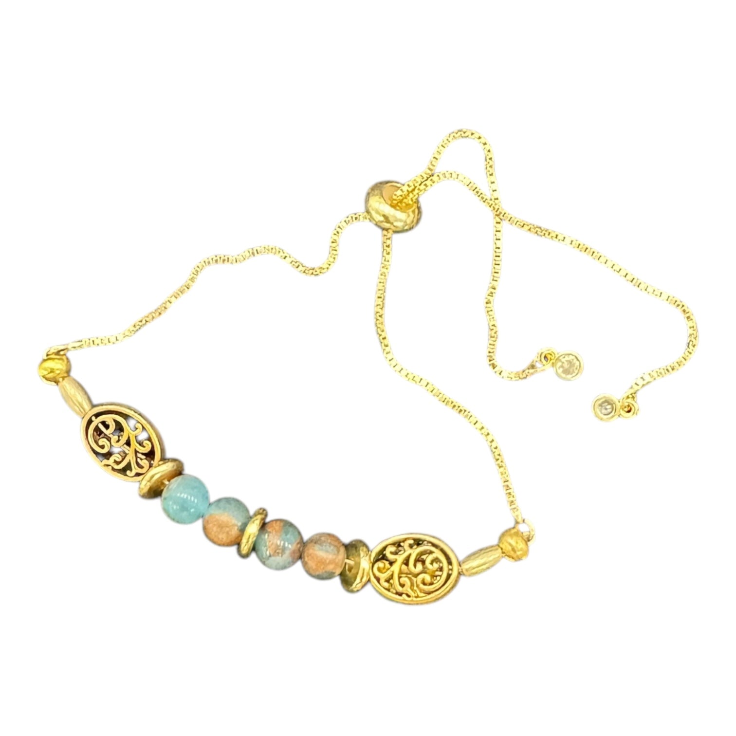 Golden Grove Bracelet by Art in Stone — handcrafted with crystals, semi-precious stones, filigree charms, and CZ details. Adjustable and unique!