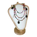 The Enchanted Forest Necklace by Art In Stone Jewellery features multicoloured gemstones, silver leaf charms, and earthy beaded details for a woodland-inspired look.