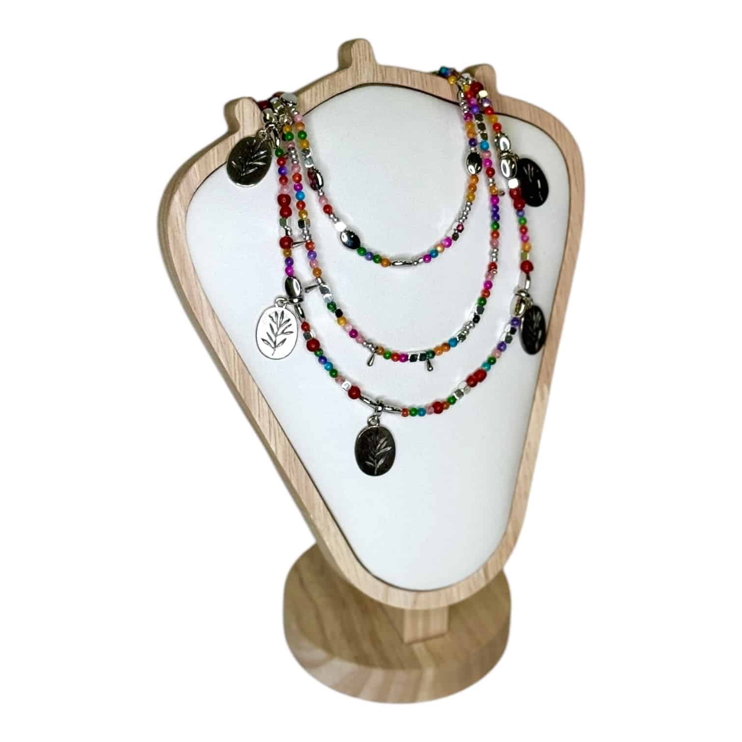 The Enchanted Forest Necklace by Art In Stone Jewellery features multicoloured gemstones, silver leaf charms, and earthy beaded details for a woodland-inspired look.