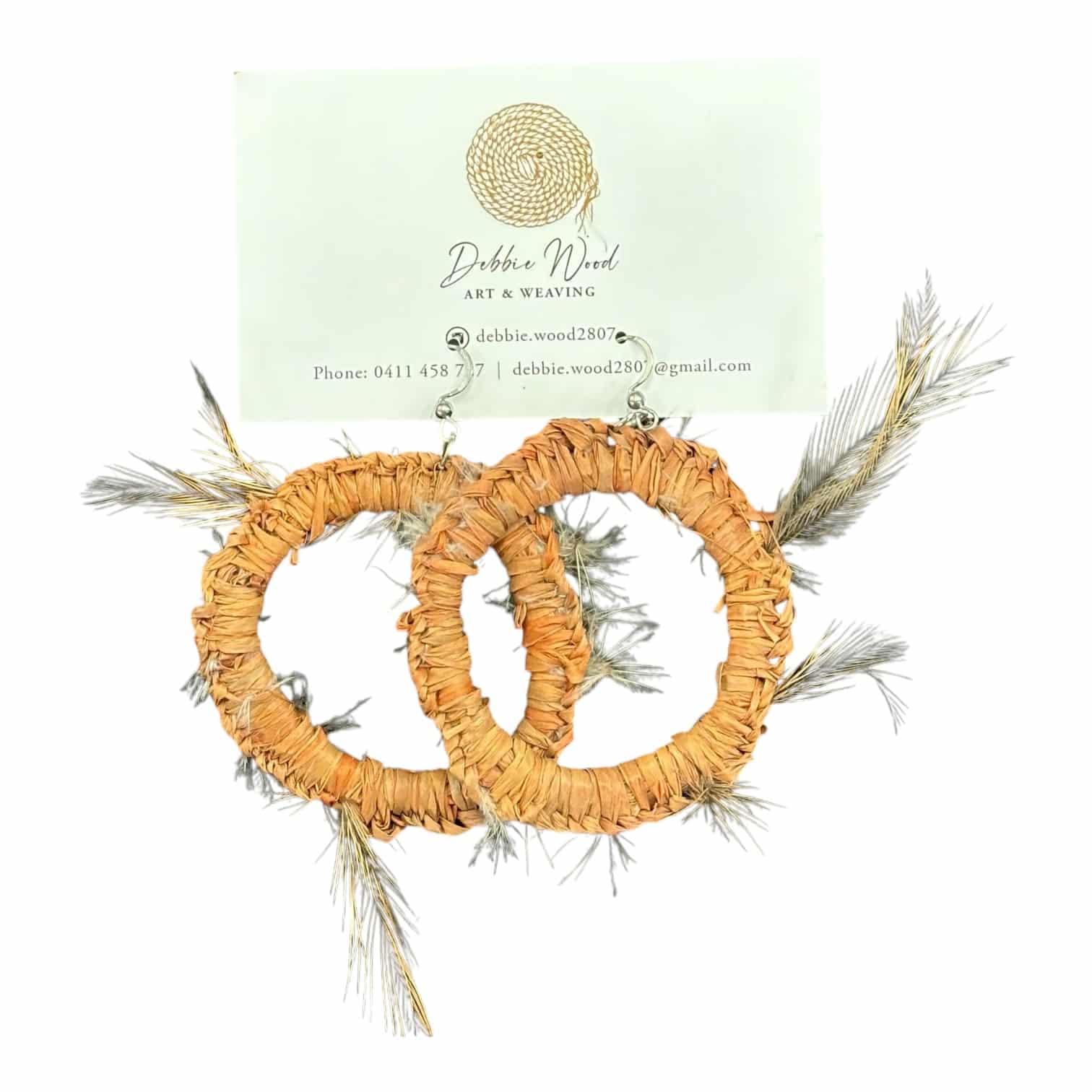 Discover Feathered Harmony Handwoven Earrings by Debbie Wood, crafted from raffia and emu feathers for an earthy, elegant look.