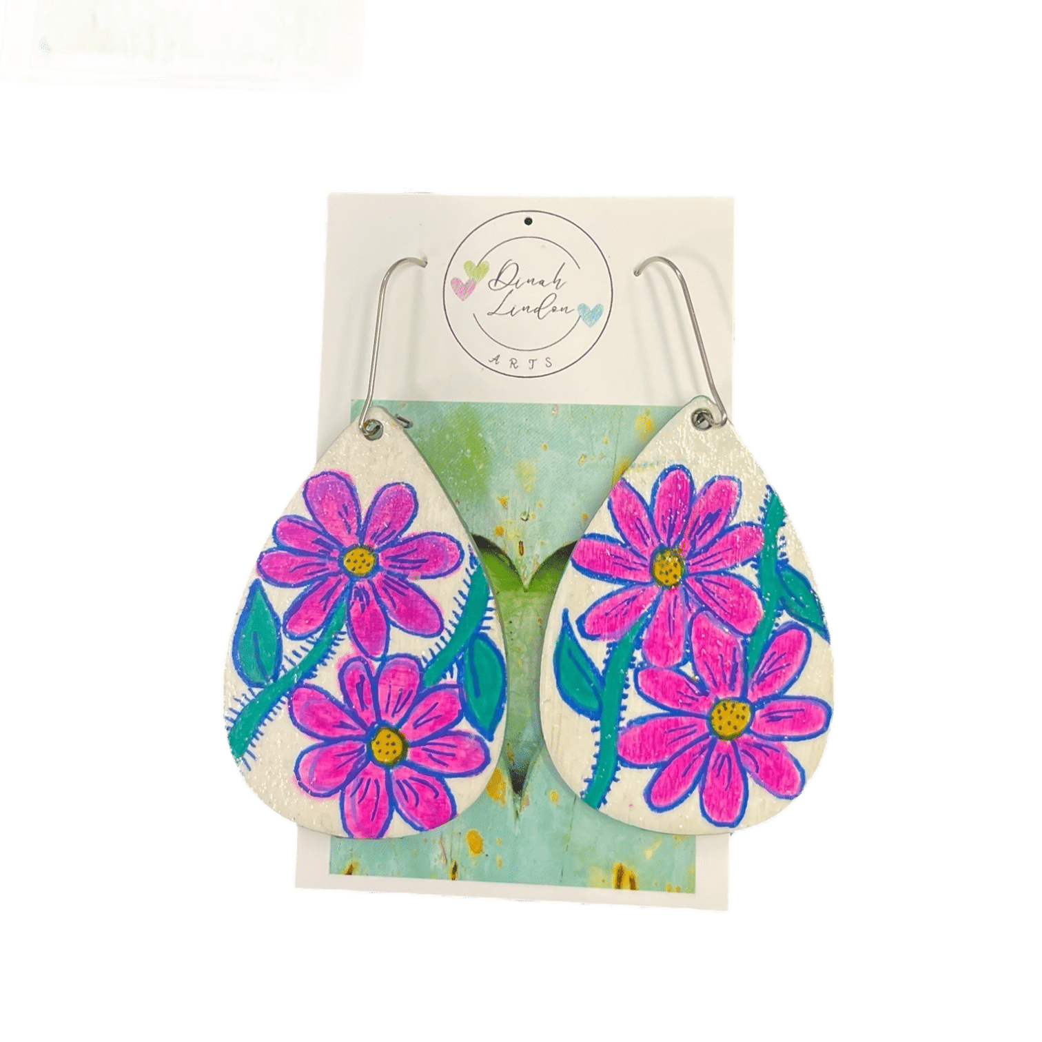 Cosmic Daisy Drops – bright teardrop earrings with pink daisies and green stems on a glossy white background by Dinah Lindon.