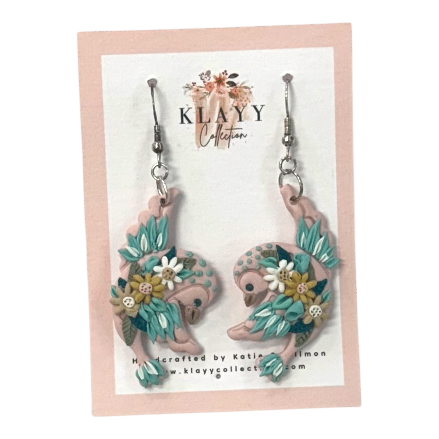 Daisy Dancers by Klayy Collection – handmade polymer clay swallow earrings with floral details. Lightweight, whimsical & full of joyful movement.