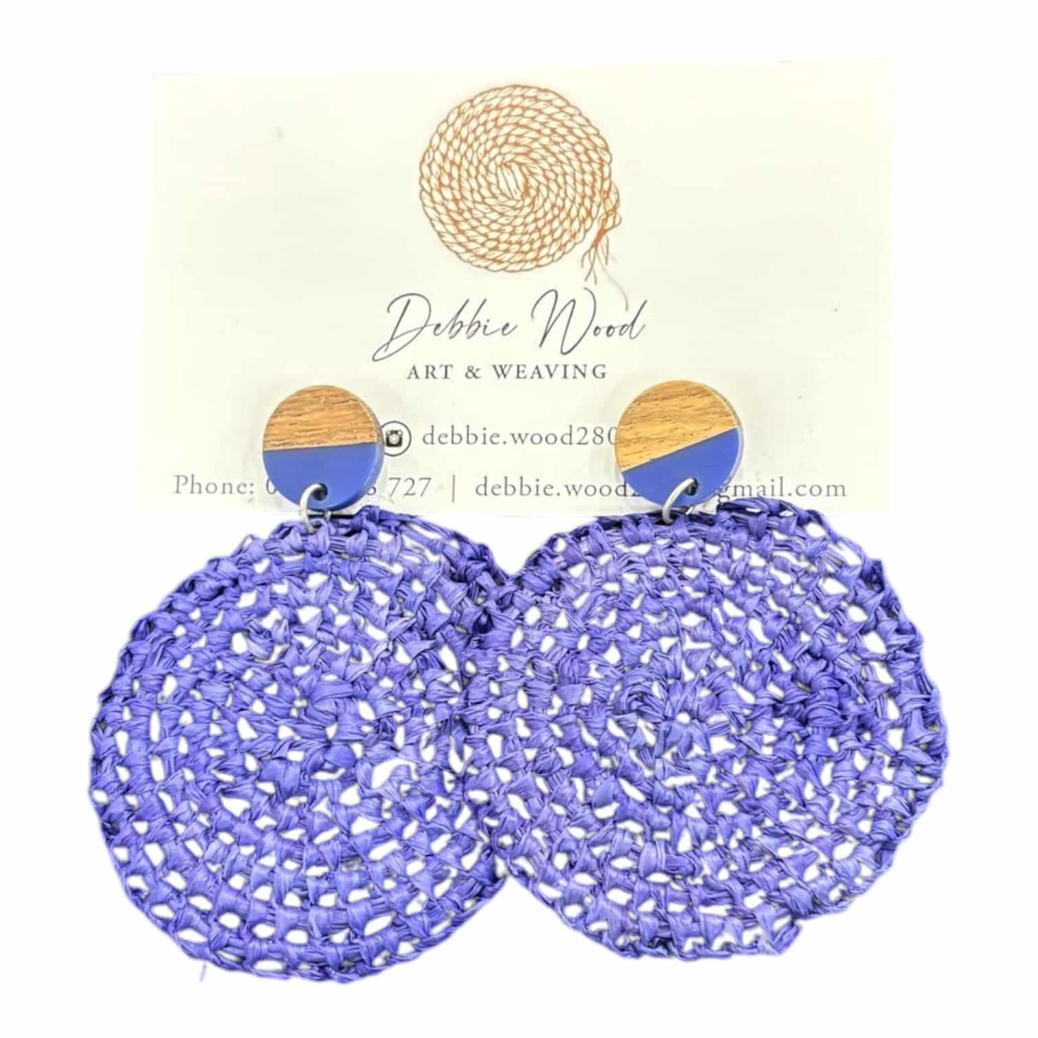 Embrace elegance with "Purple Dream" raffia earrings—handwoven raffia in soft lavender, designed by Debbie Wood. Natural yet playful!