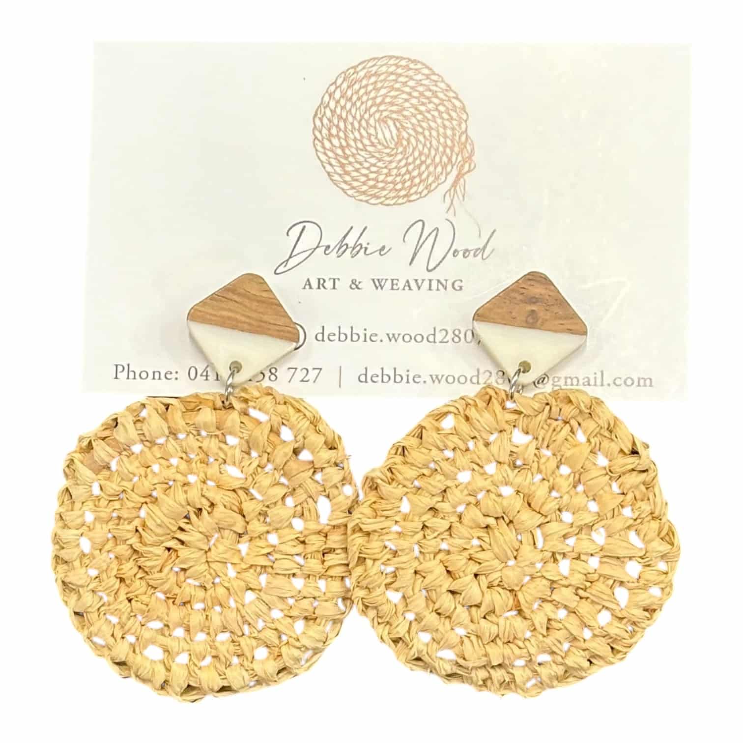 Natural Essence handwoven earrings by Gomeroi artist Debbie Wood. Simple, earthy raffia earrings with a neutral palette for versatile style.