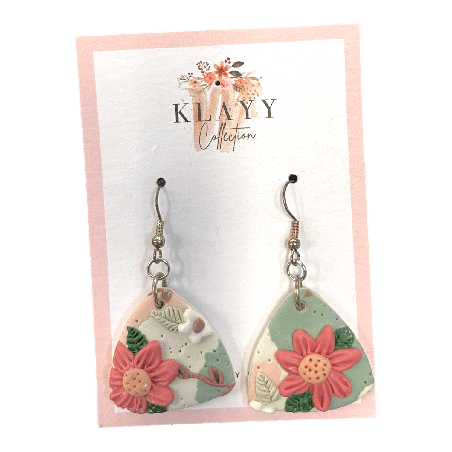 Peach Bloom earrings feature soft blush petals on a marbled sage and peach base. Subtle, floral, and handmade.