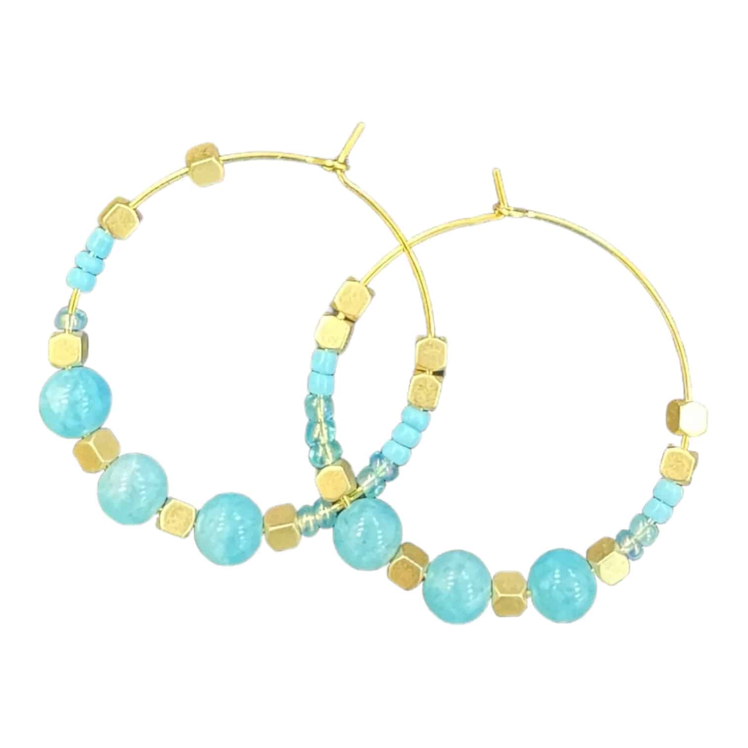 Add a pop of colour with Turquoise Waters earrings by Maggie Deall. Features vibrant turquoise beads with golden accents.