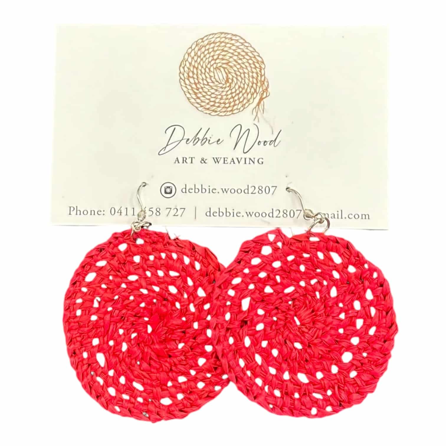 Ruby Glow handwoven earrings by Gomeroi artist Debbie Wood. Bright red raffia earrings that bring energy and style to any outfit.
