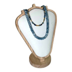 The Midnight Waves Necklace by Art In Stone Jewellery features sodalite, aquamarine, and gold-plated beads, inspired by the beauty of the ocean.