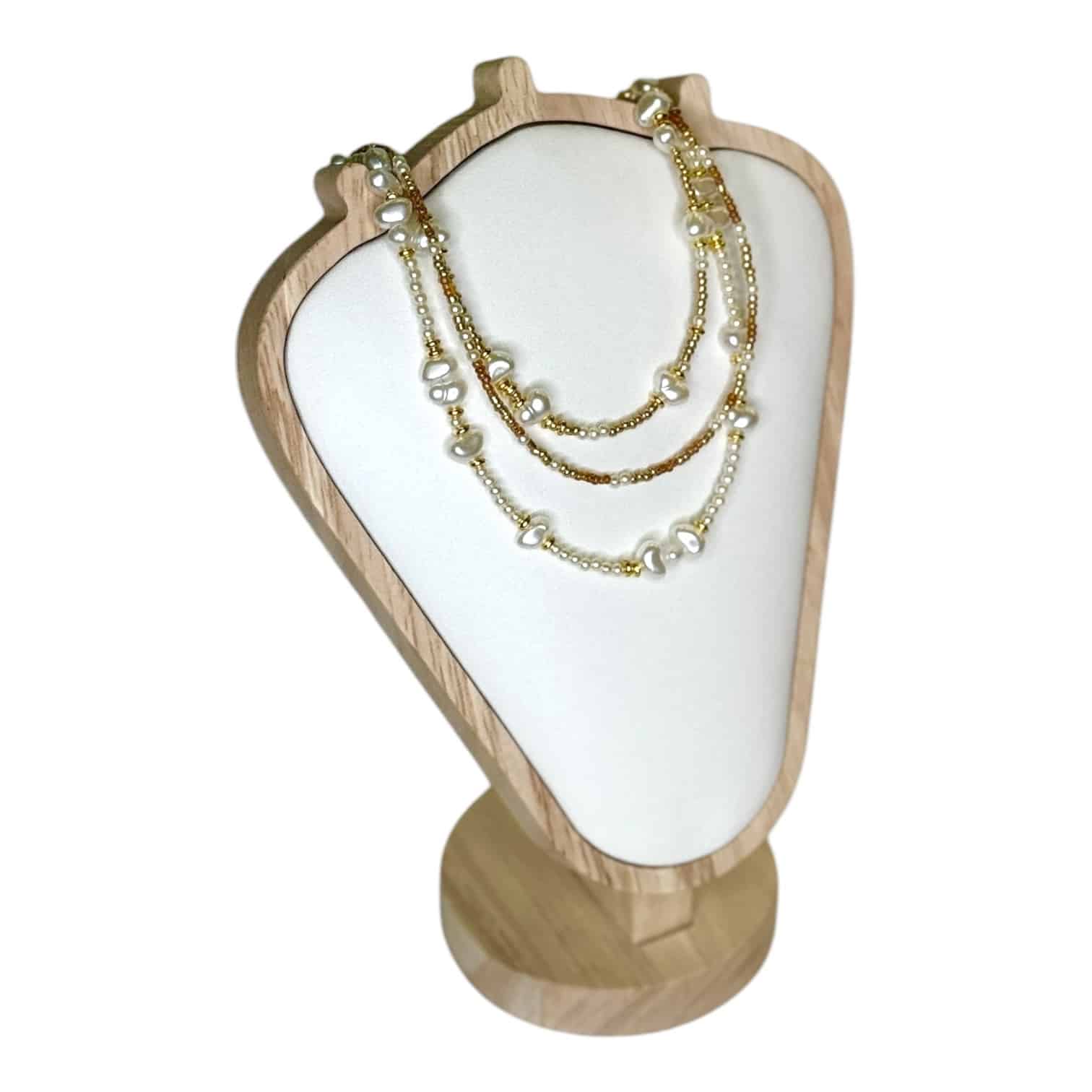 The Golden Pearl Cascade Necklace by Art In Stone Jewellery features freshwater pearls, gold accents, and elegant layered strands for a timeless look.