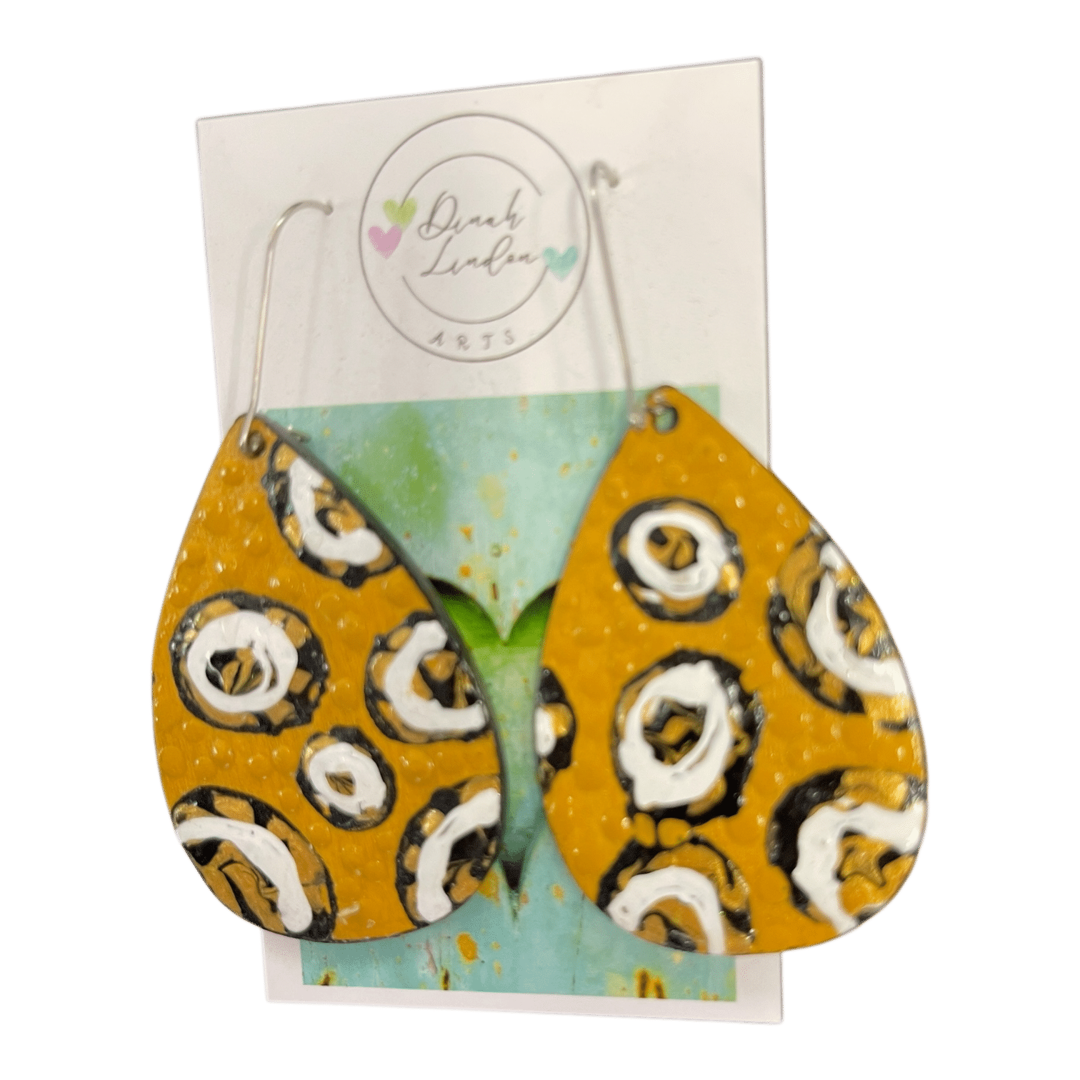 Honey Dot Drops – mustard yellow earrings with bold black and white circular motifs and a glossy finish.