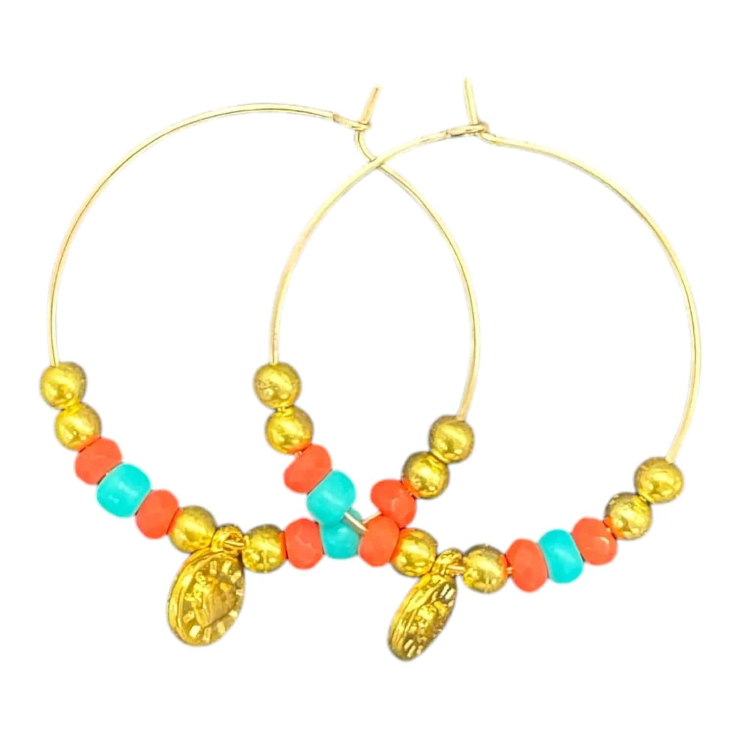 Sunset Fiesta Hoops by Art in Stone — handmade hoops with orange and turquoise beads, gold accents, and medallion charm. One of a kind!