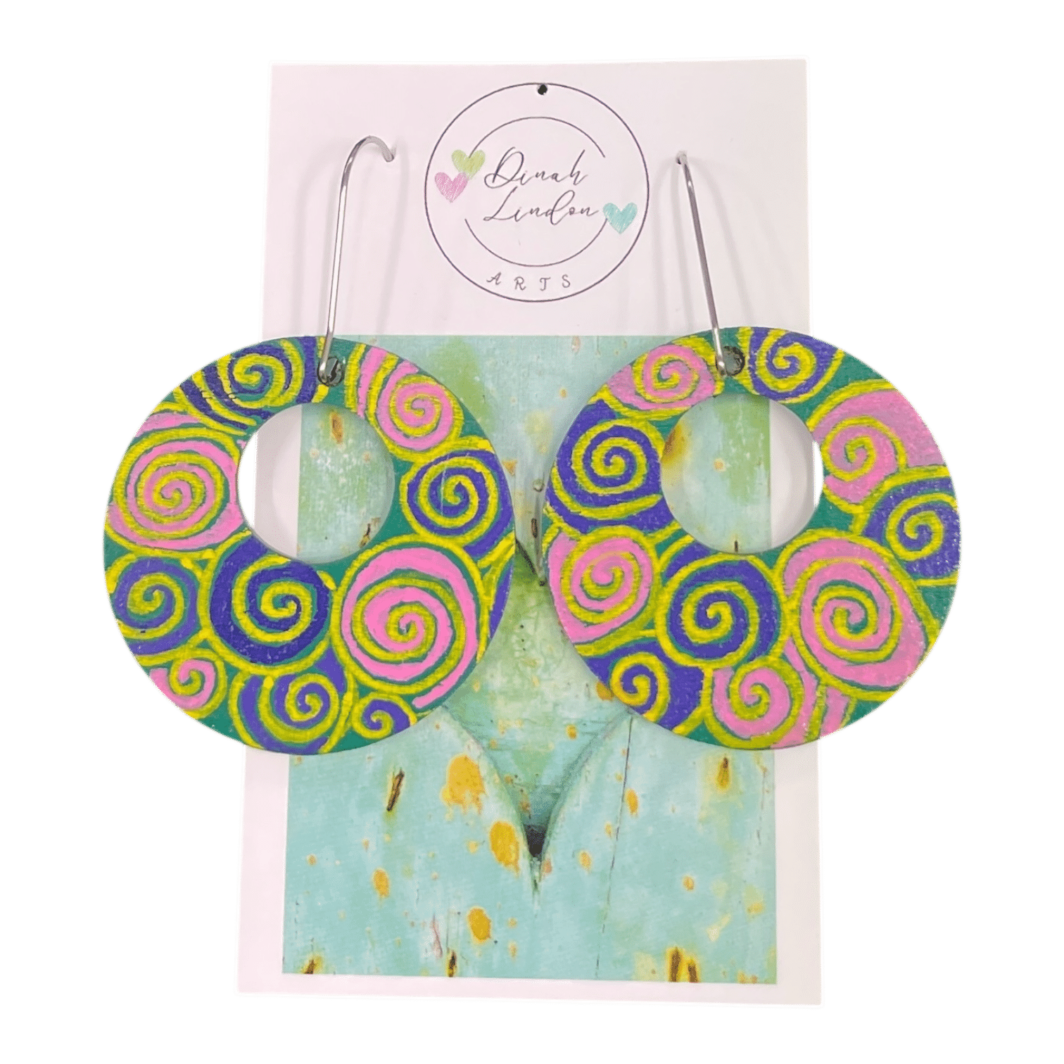 Neon Spiral Disco Hoops – bold round earrings with handpainted spirals in pink, yellow, and purple. by Dinah Lindon Artist.