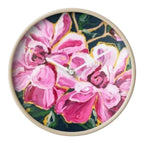 Add moody elegance to your space with the Midnight Peonies Clock by Maggie Deall. A bold floral design with timeless appeal.
