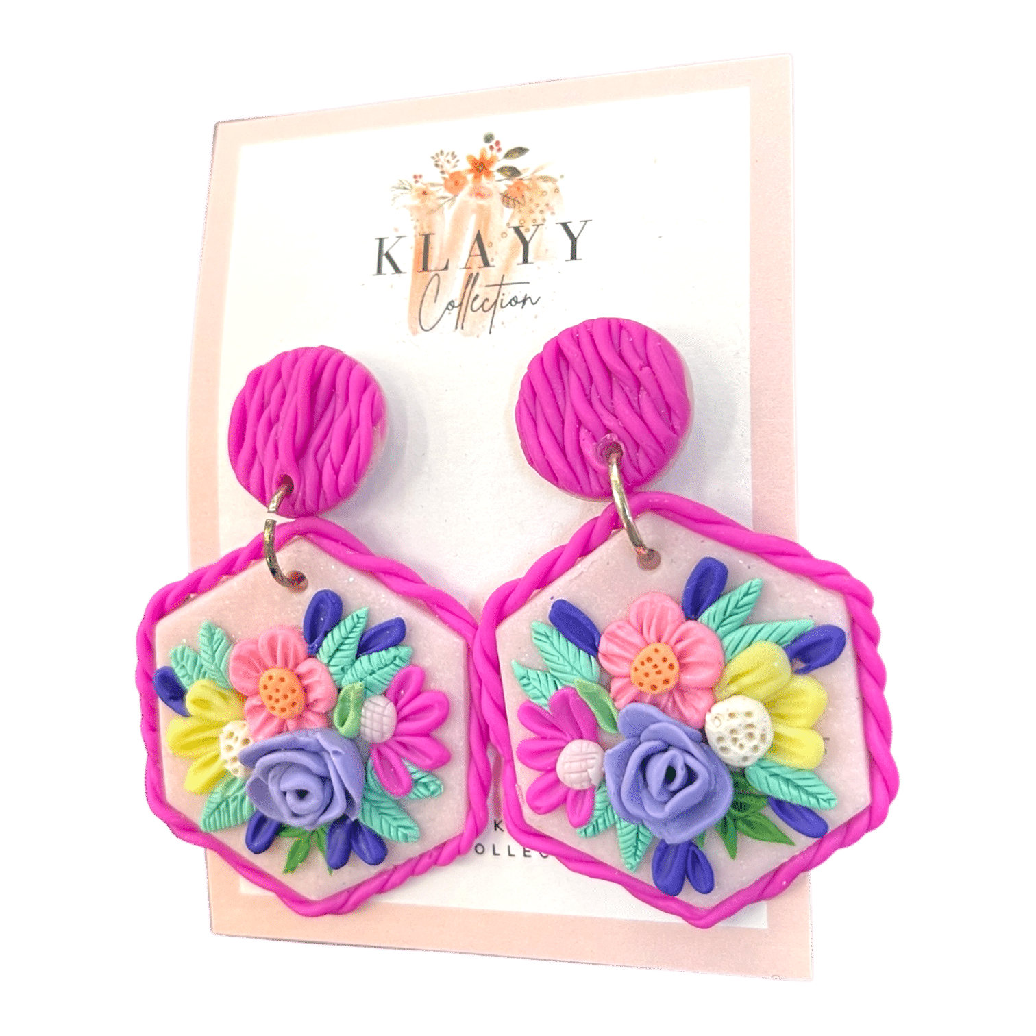 Floral Fiesta earrings burst with pastel flowers on a blush hexagon base with magenta twist detailing. Handmade joy in every petal.