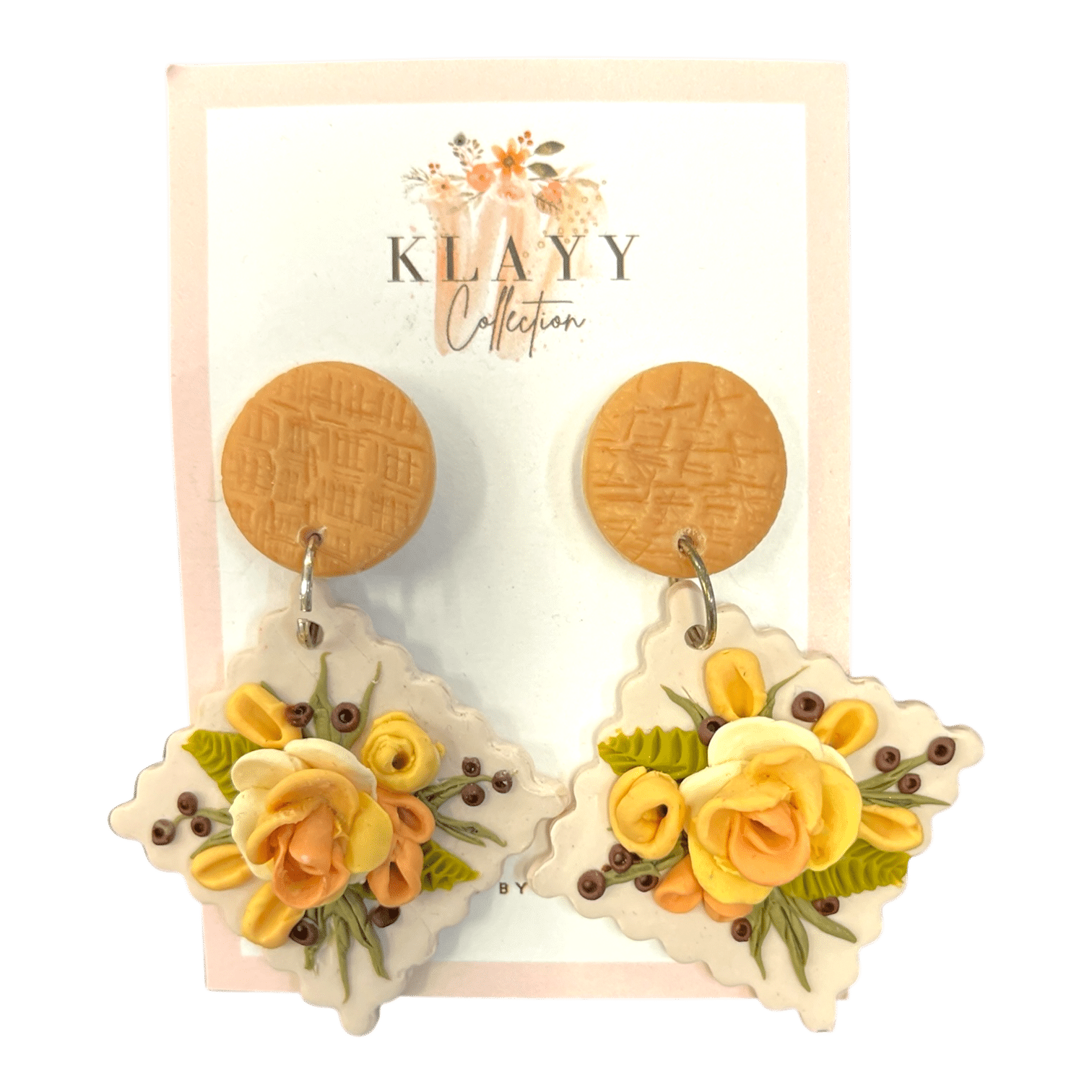 Lemon Meringue earrings combine yellow florals with earthy greens on a soft clay base. Bright, warm, and handmade.
