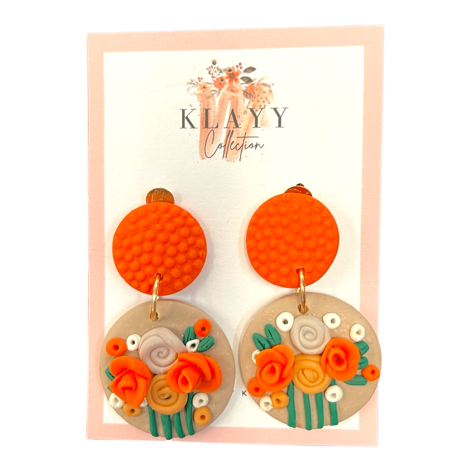 Clementine Bloom earrings feature vibrant orange studs and blooming florals in citrus shades. Bright, bold, and handmade fun.