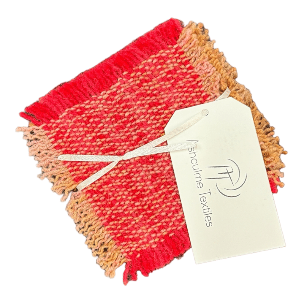 Discover the unique beauty of our Vibrant Sunset Coaster, handwoven from alpaca and silk wool, dyed with natural bush dyes. Perfect for adding a touch of color to any space.