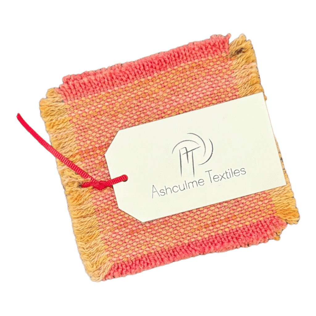 Brighten your mornings with the Sunrise Glow Coaster, hand-dyed and woven from alpaca and silk wool. Each piece is unique and adds a cheerful touch to your home.