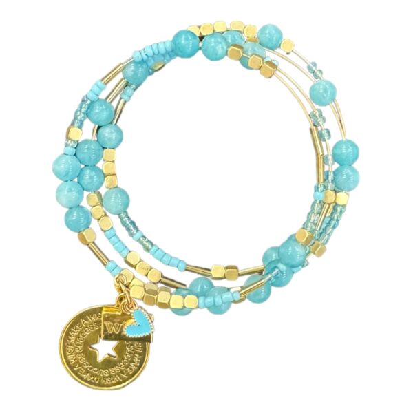 Make your dreams come true with the handmade "Wish" memory wire bracelet, featuring soft blue gemstones, crystals, and a gold-plated charm. A magical and inspiring accessory.