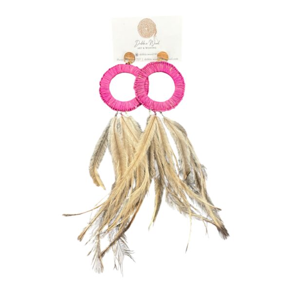 Add a pop of style with the Pink Sunset Earrings by Debbie Wood. Handwoven raffia and emu feathers make these earrings a statement piece.