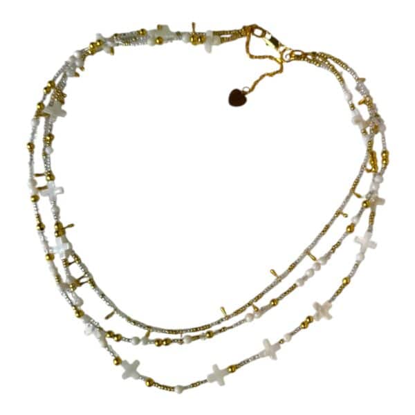 Handmade Celestial Cross Necklace featuring mother-of-pearl cross beads, shimmering seed beads, and gold accents by Art In Stone Jewellery.