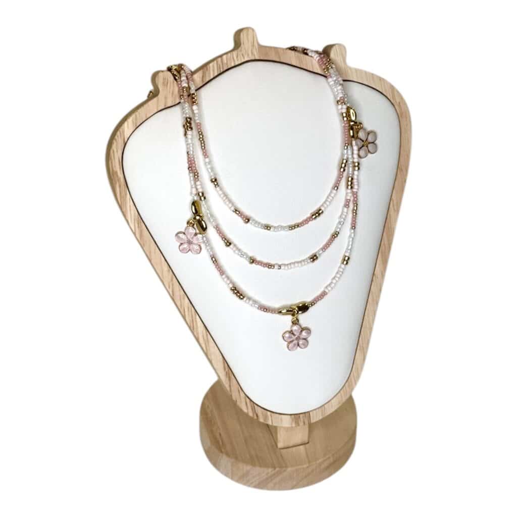 The Sakura Blossom Necklace by Art In Stone Jewellery features rose quartz flowers, soft pink tones, and gold accents, inspired by cherry blossoms.
