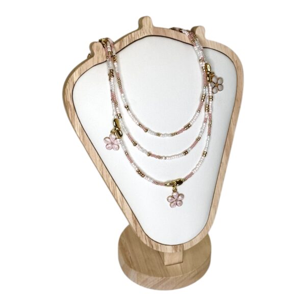 The Sakura Blossom Necklace by Art In Stone Jewellery features rose quartz flowers, soft pink tones, and gold accents, inspired by cherry blossoms.
