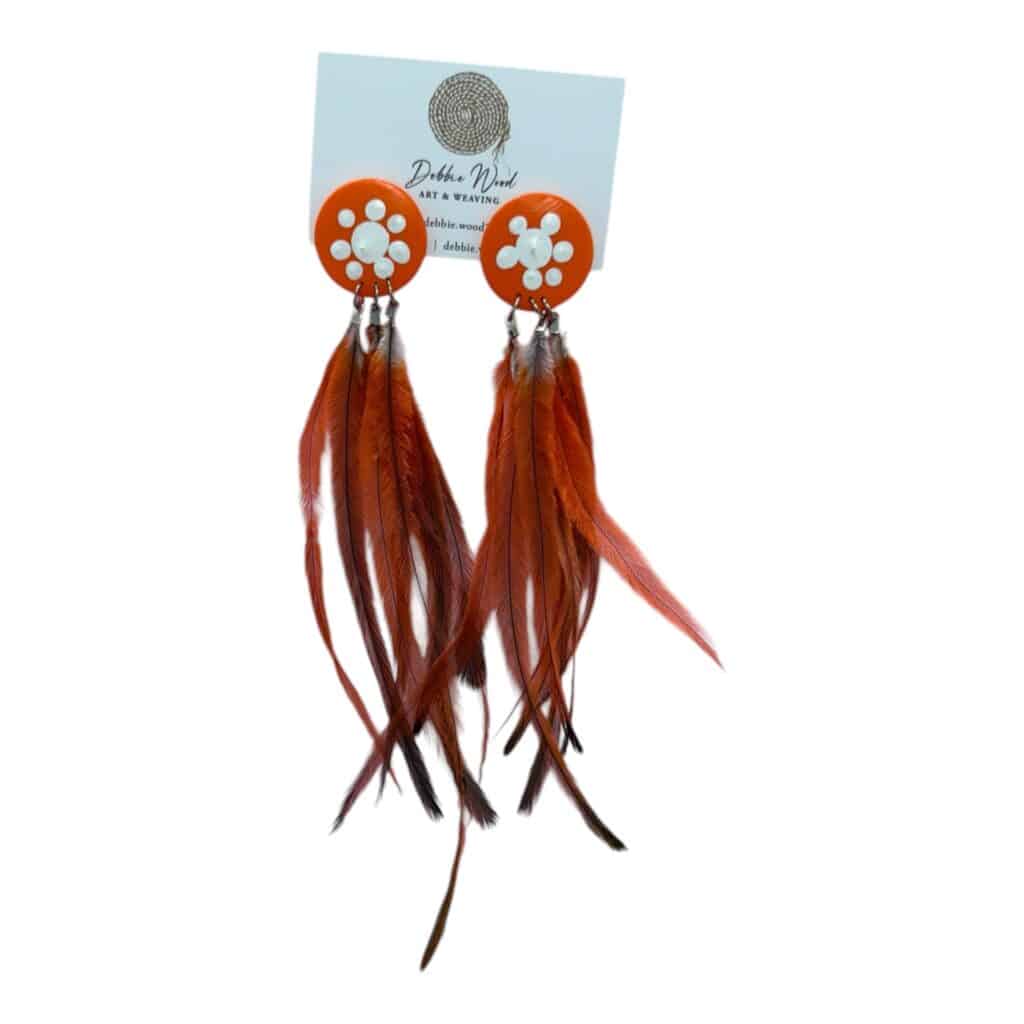 Fire Spirit Earrings by Debbie Wood – orange and white hand-painted studs with ethically sourced red-orange feathers.