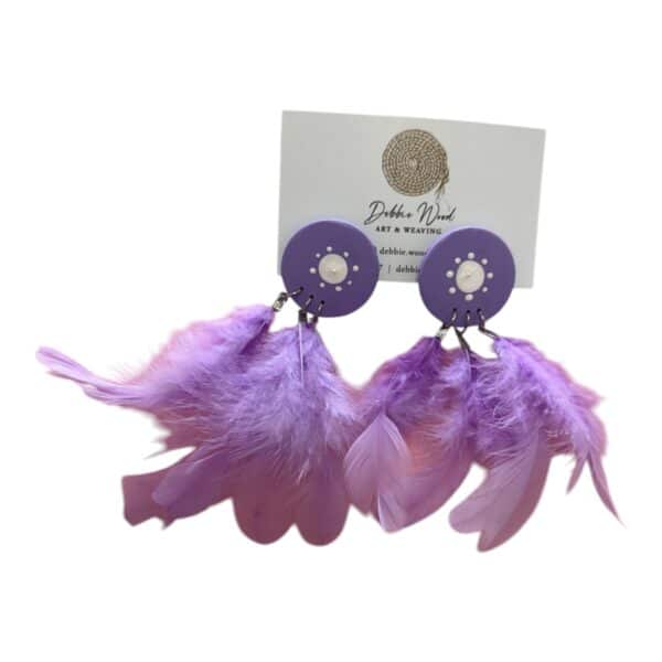 Sunset Song Earrings by Debbie Wood – hand-painted purple studs and ethically sourced lavender feathers with soft, elegant flow.