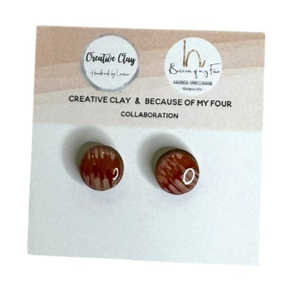 Ginny 10mm Round Studs 2 feature Amanda Hinkelmann’s hand-painted design in resin. A modern, wearable collaboration with Creative Clay.