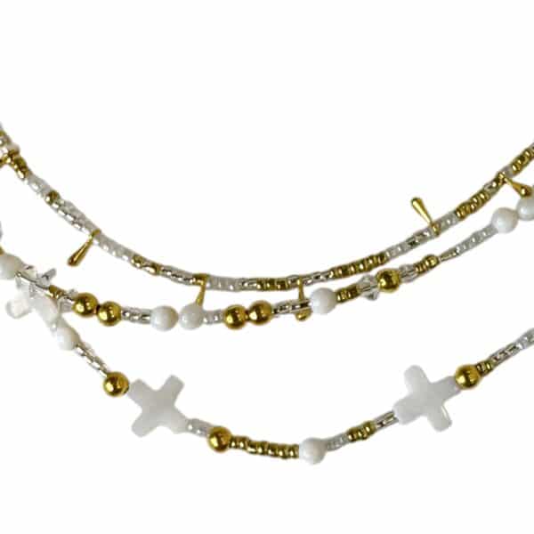 Handmade Celestial Cross Necklace featuring mother-of-pearl cross beads, shimmering seed beads, and gold accents by Art In Stone Jewellery.