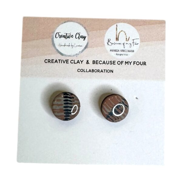Ginny 10mm Round Studs 5 are handmade earrings featuring Amanda Hinkelmann’s art in soft clay tones with charcoal accents.