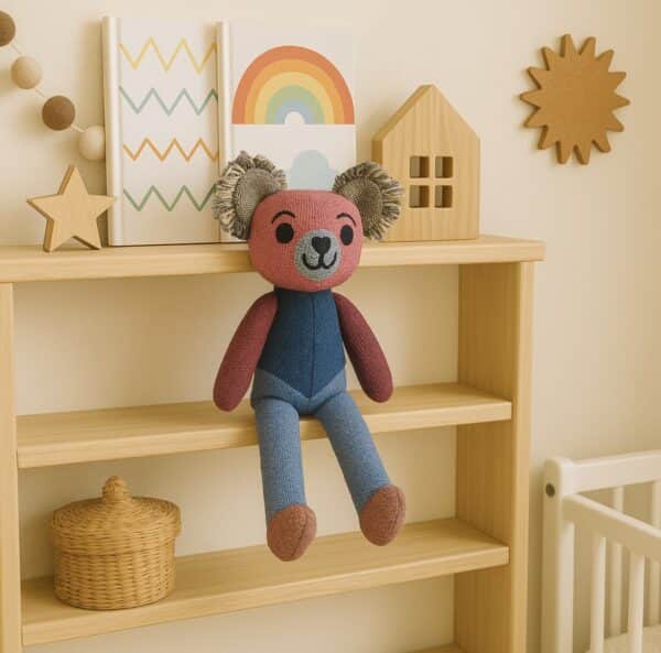 Poppy Patch Teddy is a vibrant patchwork teddy bear made from handwoven alpaca and merino wool with love by Ashculme Textiles.