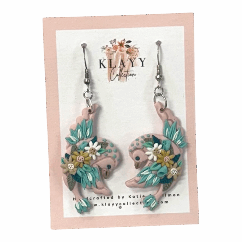 Daisy Dancers by Klayy Collection – handmade polymer clay swallow earrings with floral details. Lightweight, whimsical & full of joyful movement.