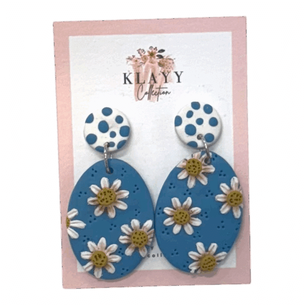 Daisy Days polymer clay earrings by Klayy Collection – fun, handmade blue daisy drops with retro polka-dot tops. Lightweight & full of joy!
